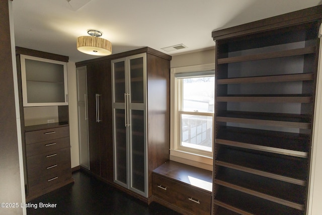 mudroom with dark hardwood / wood-style floors