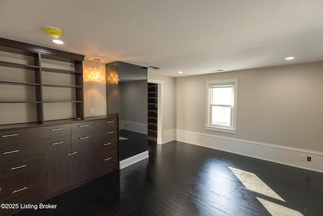 unfurnished room with dark hardwood / wood-style floors