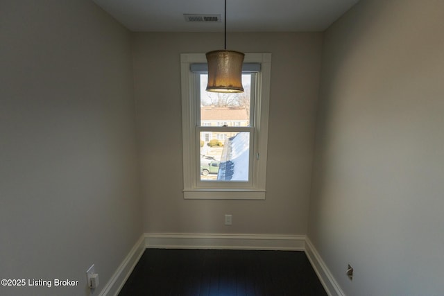 unfurnished room featuring dark hardwood / wood-style floors