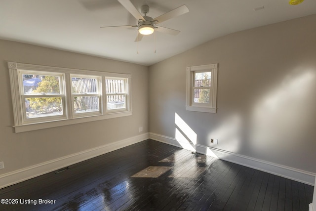 unfurnished room featuring dark wood-type flooring, ceiling fan, and lofted ceiling