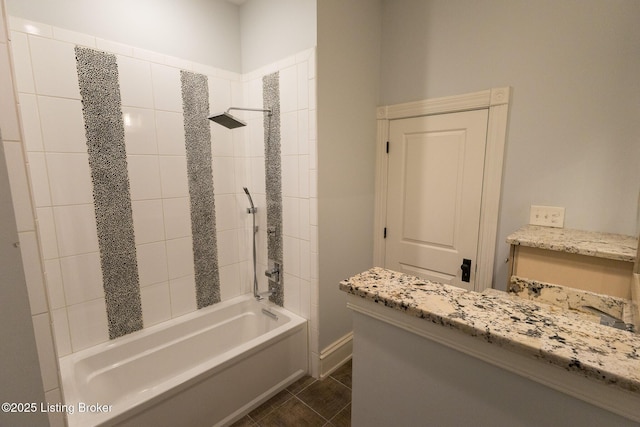 bathroom with tiled shower / bath combo and tile patterned flooring