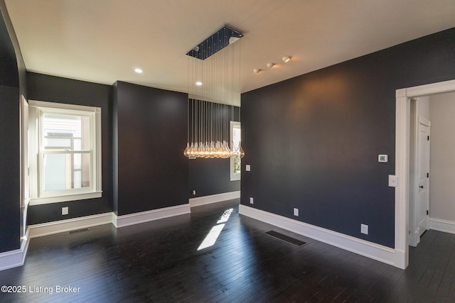 empty room featuring dark hardwood / wood-style floors