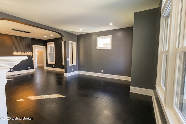 unfurnished room with dark hardwood / wood-style floors