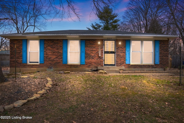 ranch-style house with a yard