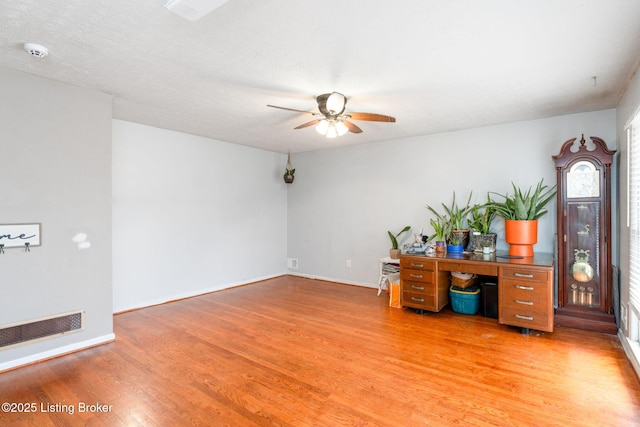 office area with hardwood / wood-style floors and ceiling fan