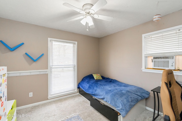 bedroom featuring cooling unit, ceiling fan, and carpet