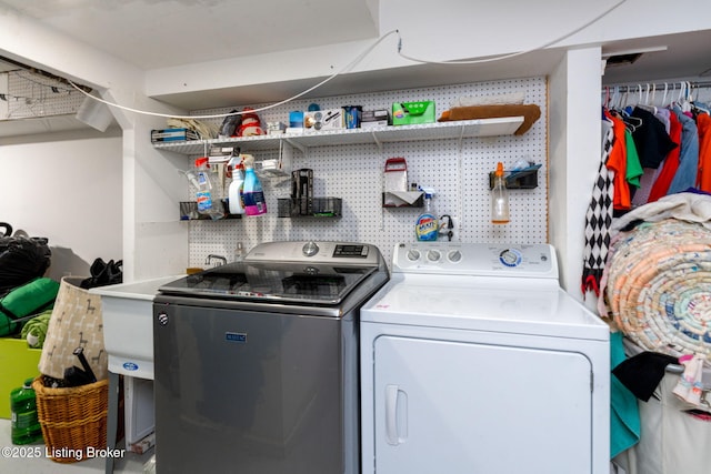 laundry area with washing machine and clothes dryer