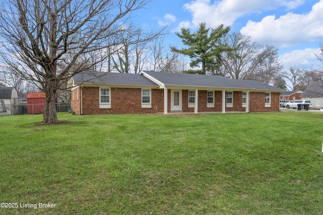 single story home featuring a front lawn