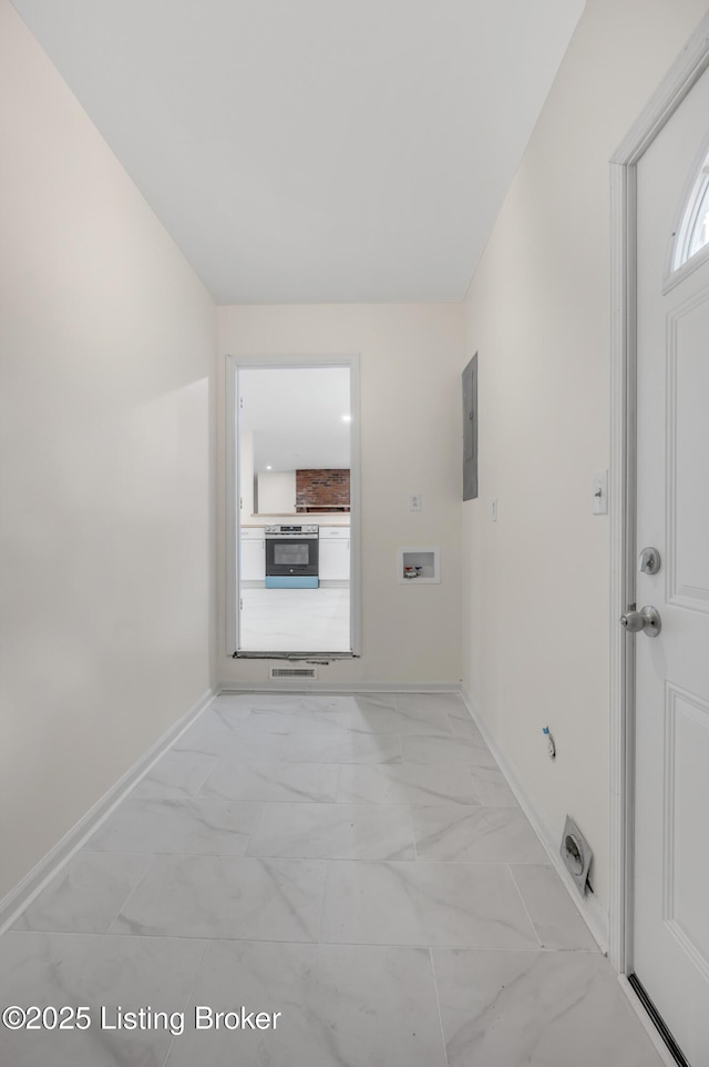 laundry area with hookup for a washing machine and electric panel