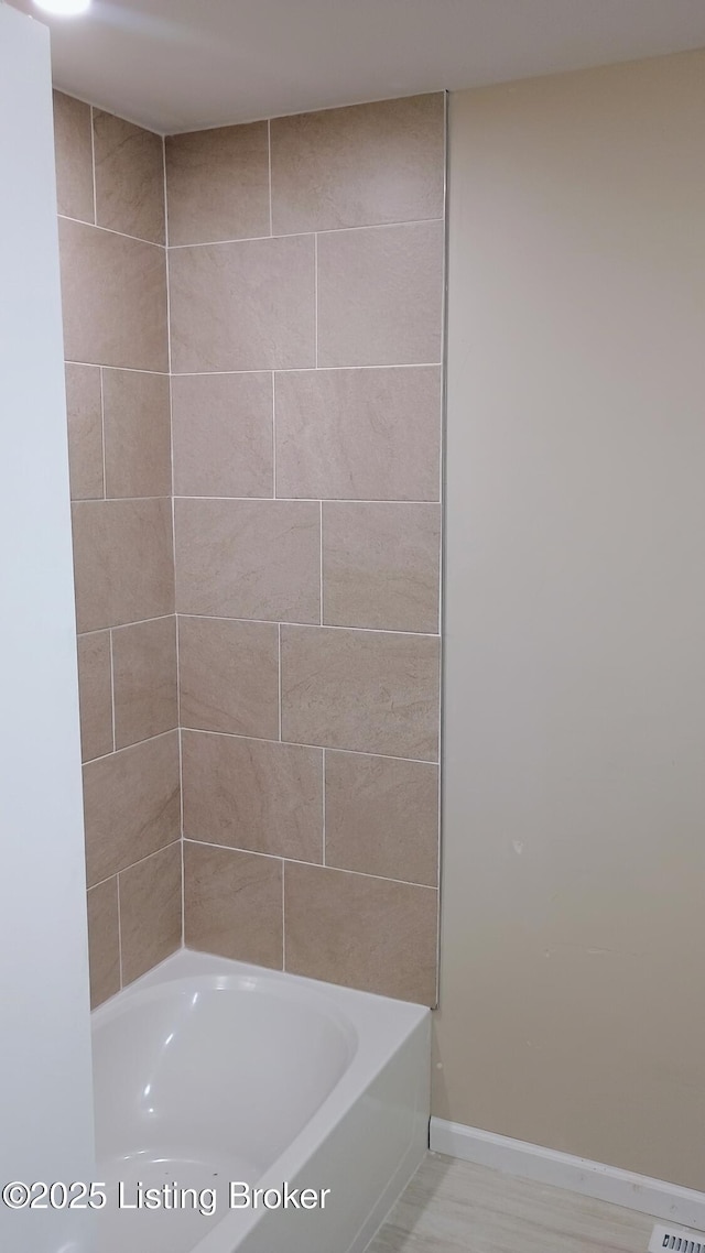 bathroom with shower / bath combination