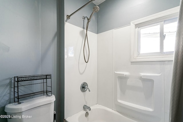 bathroom with toilet and bathtub / shower combination