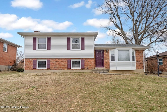 tri-level home with a front yard