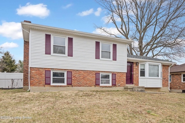 split level home with a front yard