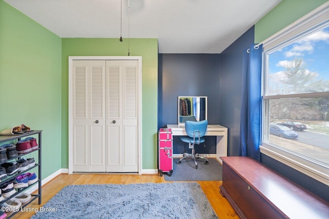 office with light hardwood / wood-style flooring