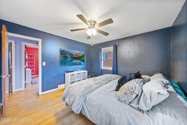 bedroom featuring light hardwood / wood-style floors and ceiling fan