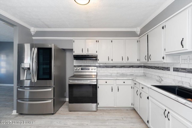 kitchen featuring white cabinetry, light wood-type flooring, and appliances with stainless steel finishes