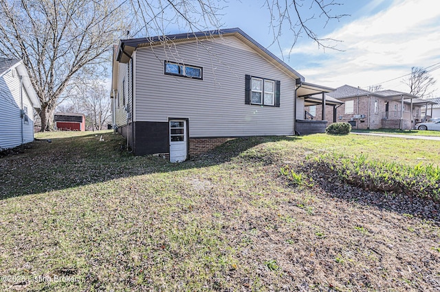 view of home's exterior with a lawn