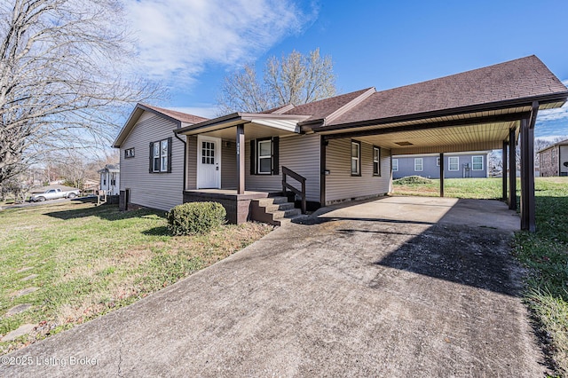 single story home with a front yard, a carport, and a porch