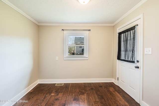 interior space featuring crown molding, dark hardwood / wood-style floors, and a textured ceiling