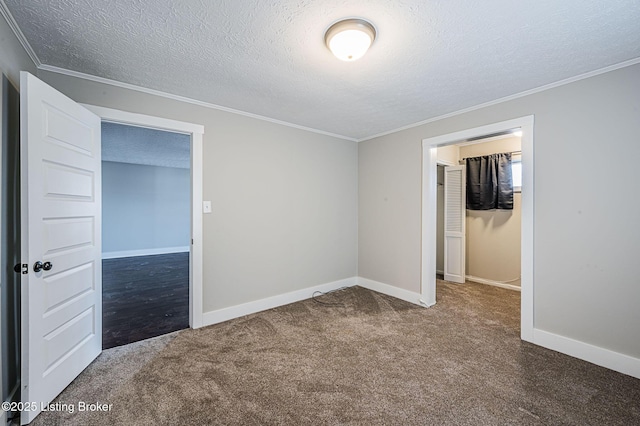 unfurnished bedroom featuring crown molding, a textured ceiling, and carpet flooring