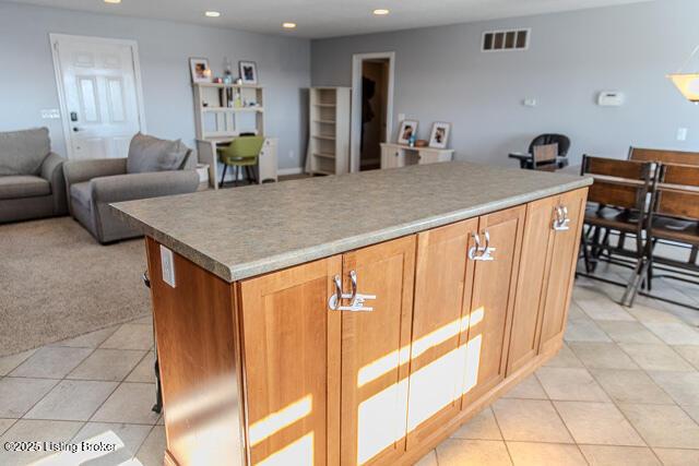 kitchen featuring a center island and light tile patterned floors