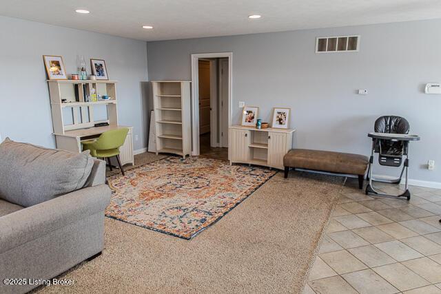 living area featuring light tile patterned floors