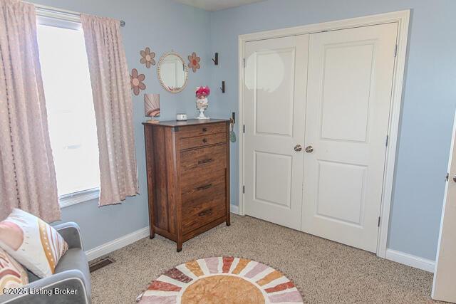 carpeted bedroom featuring a closet