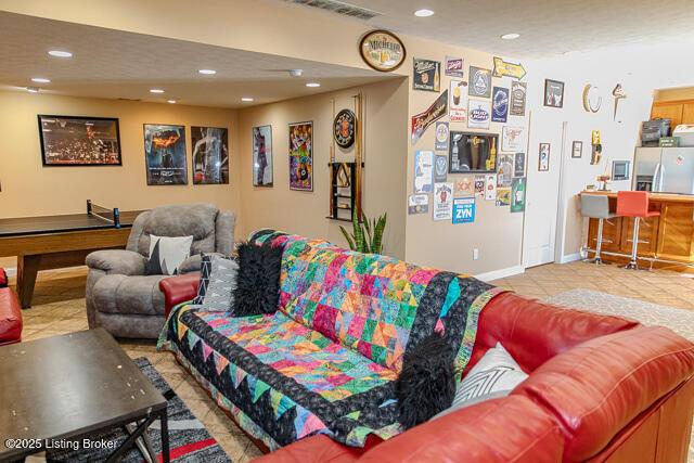 living room with light tile patterned flooring