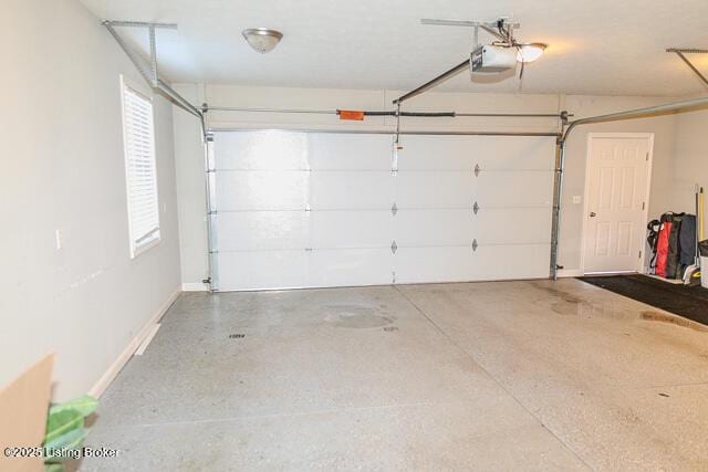 garage featuring a garage door opener