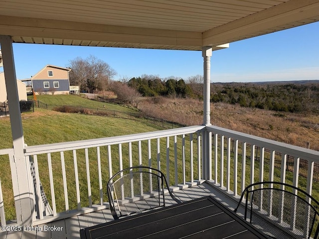 wooden deck with a yard