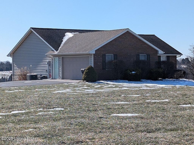 view of property exterior with cooling unit and a garage