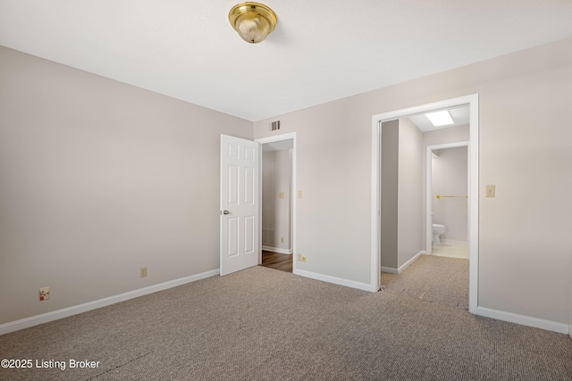 unfurnished bedroom featuring light colored carpet