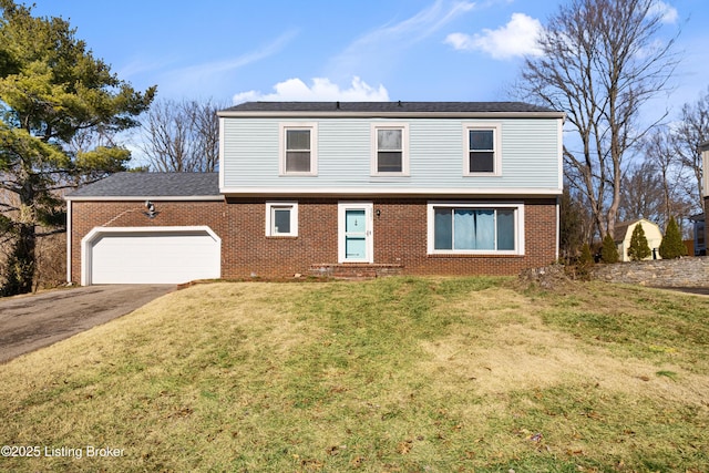 view of front property featuring a garage and a front yard