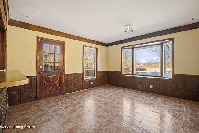 interior space featuring wood walls