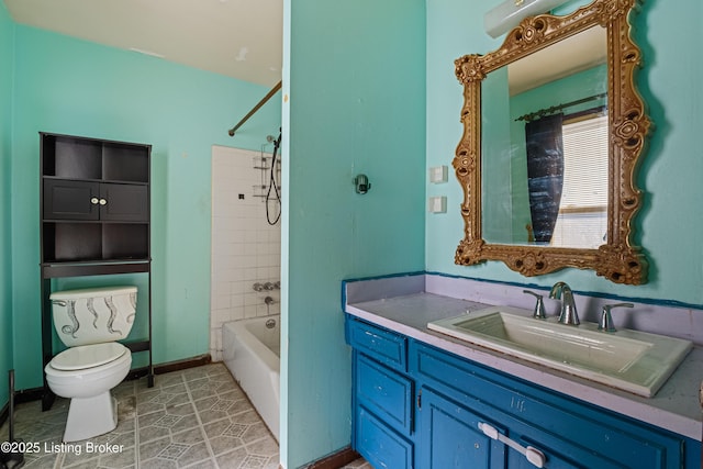 full bathroom featuring vanity, tile patterned floors, toilet, and tiled shower / bath