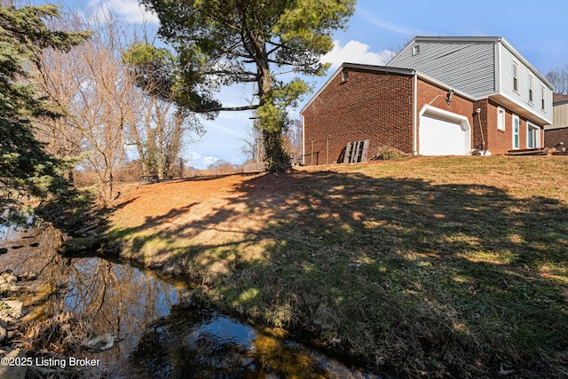 view of home's exterior with a lawn