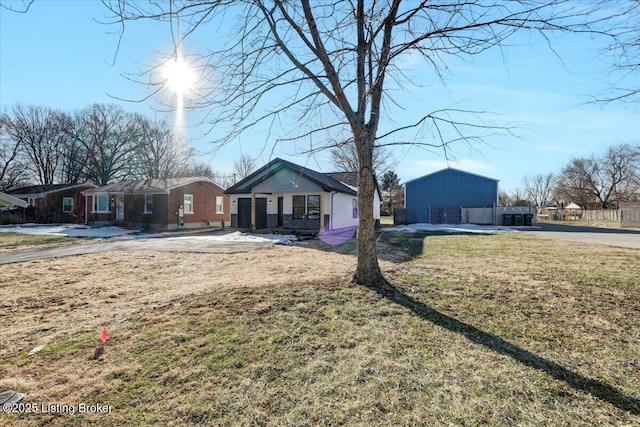 ranch-style home with a front lawn