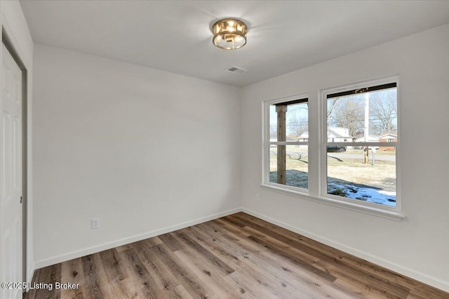 empty room with light wood-type flooring