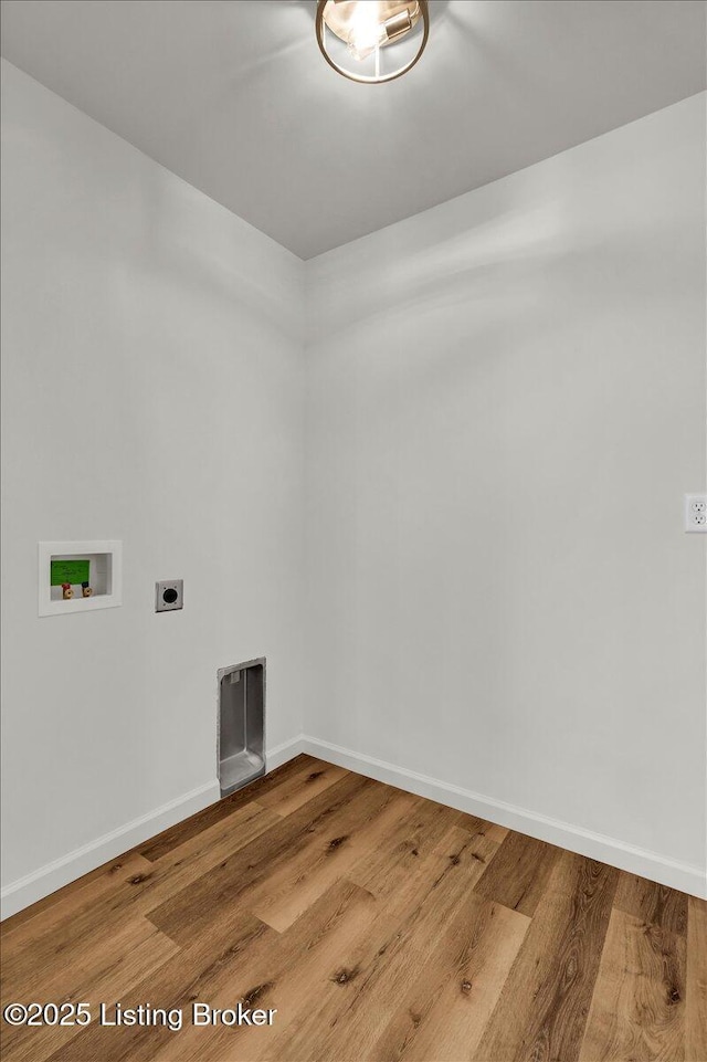 laundry room with electric dryer hookup, hookup for a washing machine, and hardwood / wood-style flooring