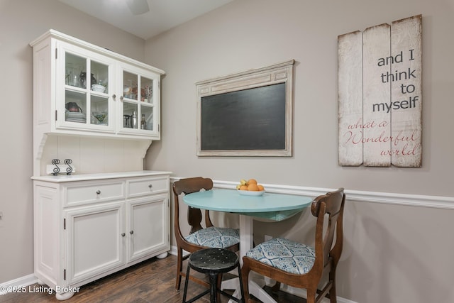 dining room with dark hardwood / wood-style flooring