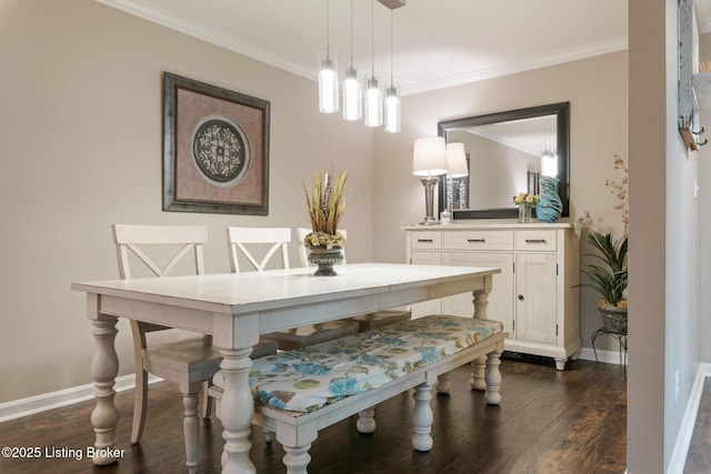 dining area featuring ornamental molding and dark hardwood / wood-style flooring