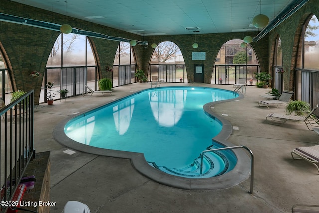 pool at dusk with a patio