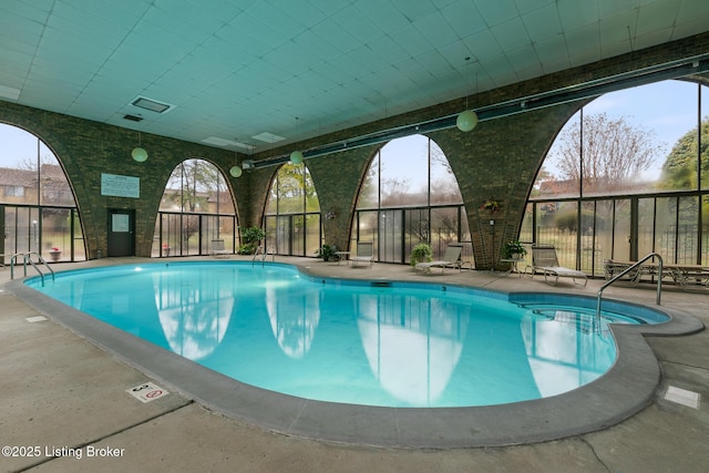 view of pool featuring a patio