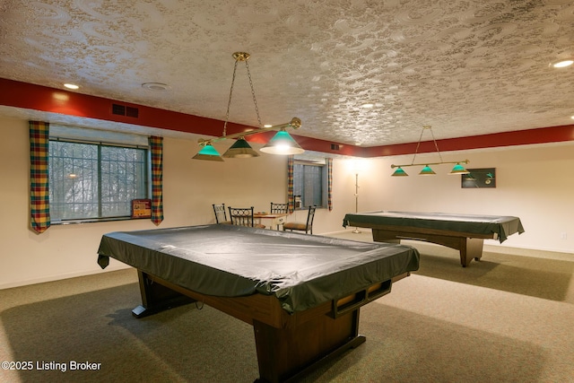 recreation room with pool table, a textured ceiling, and carpet