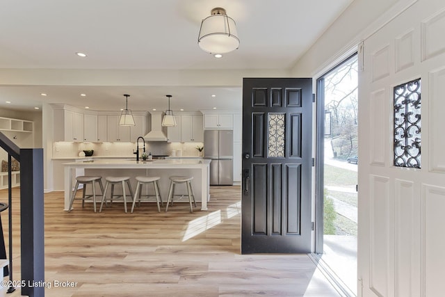 entrance foyer featuring light wood-type flooring