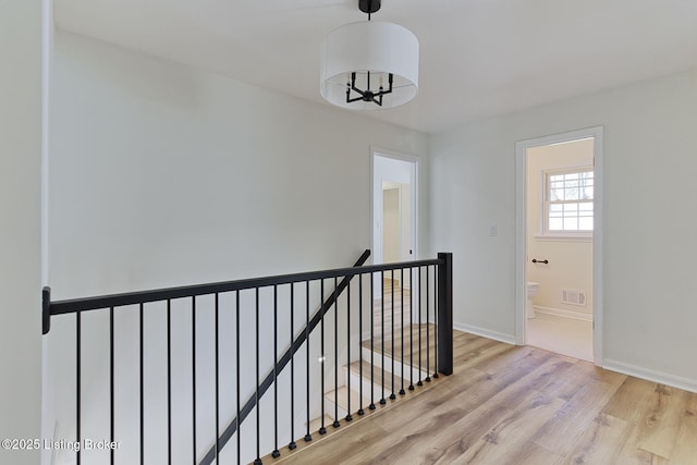 hall with light wood-type flooring