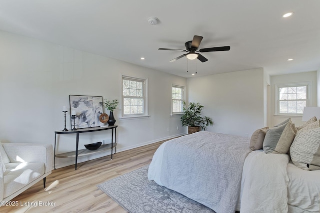 bedroom featuring ceiling fan and light hardwood / wood-style flooring