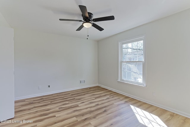 spare room with light hardwood / wood-style floors and ceiling fan