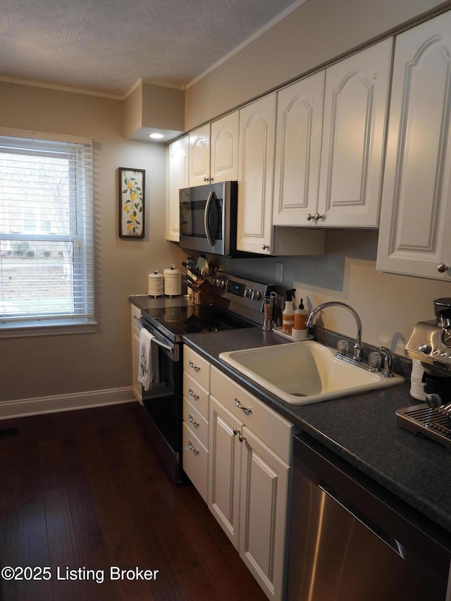 kitchen featuring appliances with stainless steel finishes and white cabinets