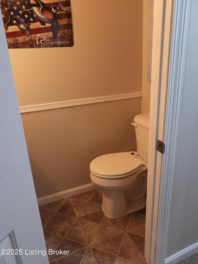 bathroom featuring tile patterned flooring and toilet